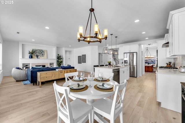 2928 S Harper Valley Way, Ridgefield, WA 98642 - dining room with visible vents, light wood finished floors, a notable chandelier, and recessed lighting