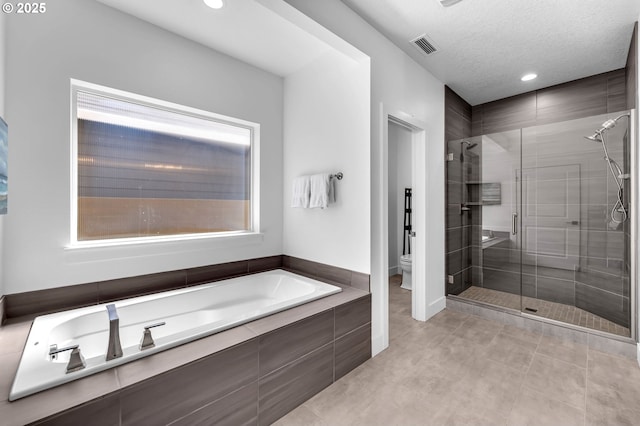 2928 S Harper Valley Way, Ridgefield, WA 98642 - full bath featuring recessed lighting, toilet, a shower stall, a bath, and visible vents