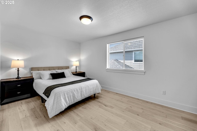 2928 S Harper Valley Way, Ridgefield, WA 98642 - bedroom featuring light wood-style flooring and baseboards