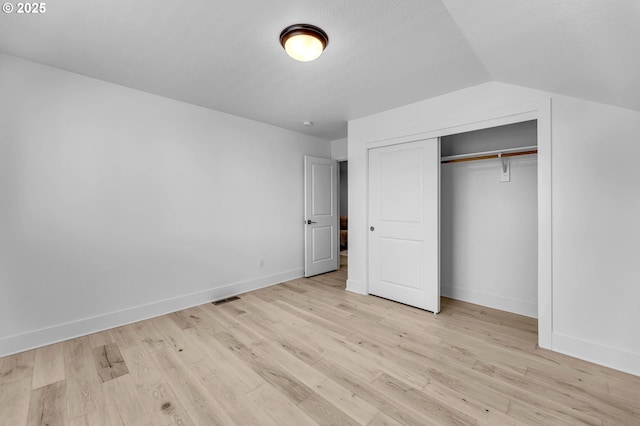 2928 S Harper Valley Way, Ridgefield, WA 98642 - unfurnished bedroom with light wood-type flooring, a closet, baseboards, and visible vents