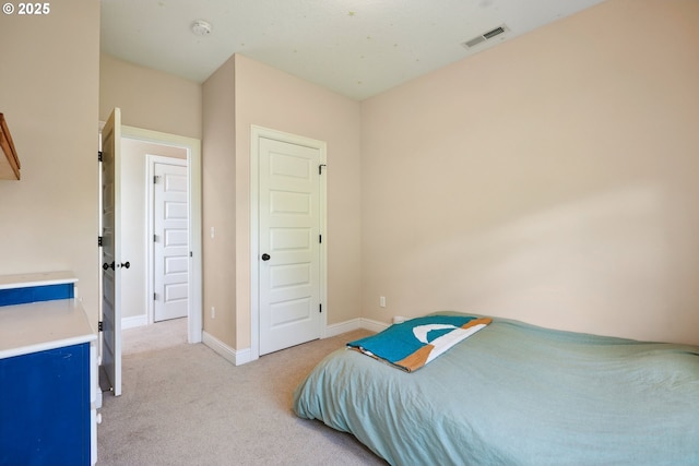 bedroom featuring carpet and baseboards