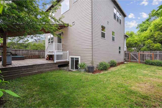 view of side of home with a wooden deck