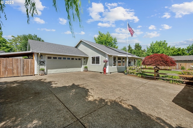 201 Shirley St, Molalla, OR 97038 - ranch-style home with an attached garage, concrete driveway, roof with shingles, and solar panels