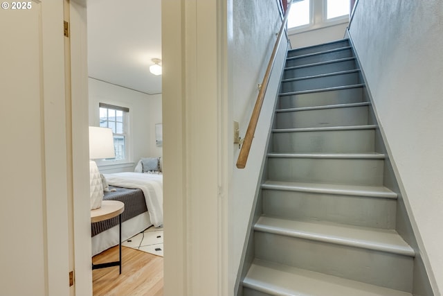 stairway featuring wood finished floors