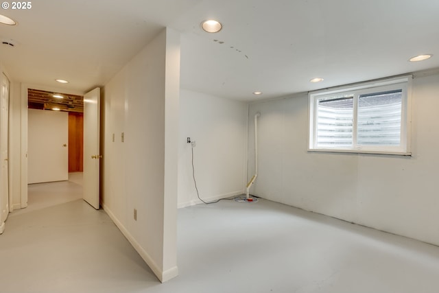 basement featuring recessed lighting and baseboards