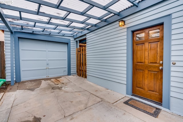 garage with concrete driveway