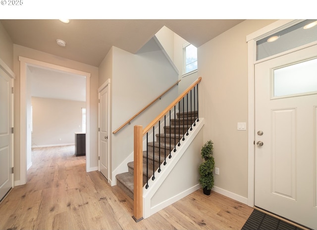 entryway with light hardwood / wood-style flooring and a wealth of natural light