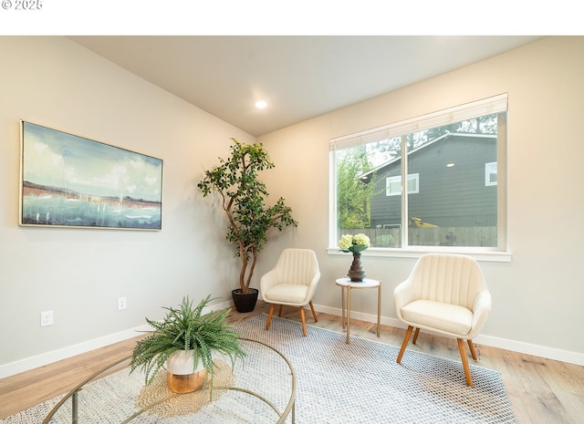 sitting room with light hardwood / wood-style flooring