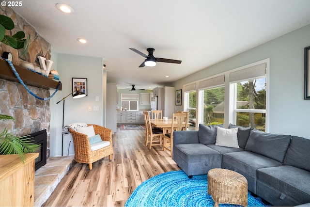 4330 Mcminnville Ave, Neskowin, OR 97149 - living area featuring light wood finished floors, a ceiling fan, a fireplace, and recessed lighting