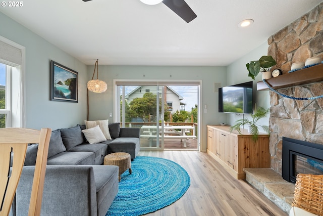 4330 Mcminnville Ave, Neskowin, OR 97149 - living room with a ceiling fan, light wood finished floors, a stone fireplace, and recessed lighting