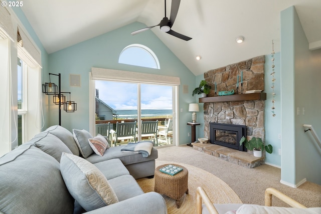 4330 Mcminnville Ave, Neskowin, OR 97149 - living area with ceiling fan, a stone fireplace, carpet, and high vaulted ceiling