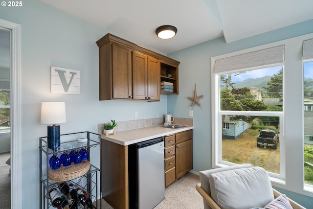 4330 Mcminnville Ave, Neskowin, OR 97149 - kitchen featuring fridge, light carpet, light countertops, and open shelves