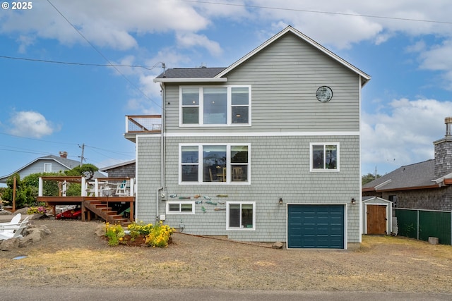 4330 Mcminnville Ave, Neskowin, OR 97149 - rear view of house with a garage, stairway, a deck, a storage shed, and driveway