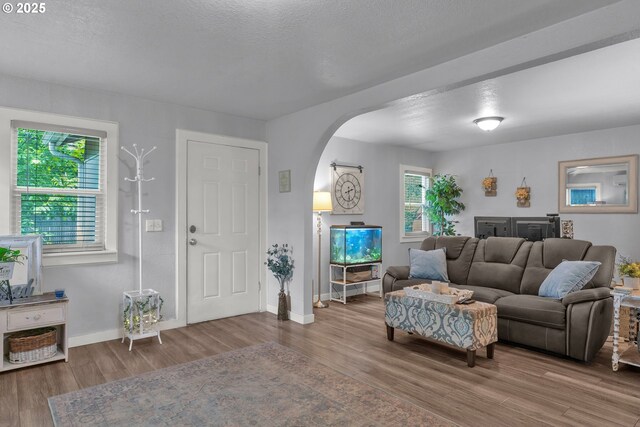 3911 E 16th Ave, Eugene, OR 97403 - living area featuring arched walkways and wood finished floors