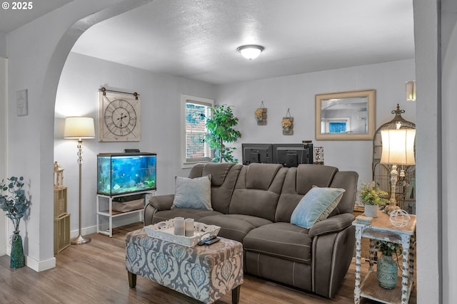 3911 E 16th Ave, Eugene, OR 97403 - living area featuring arched walkways and wood finished floors