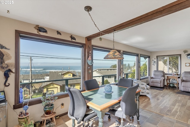 dining room with beamed ceiling