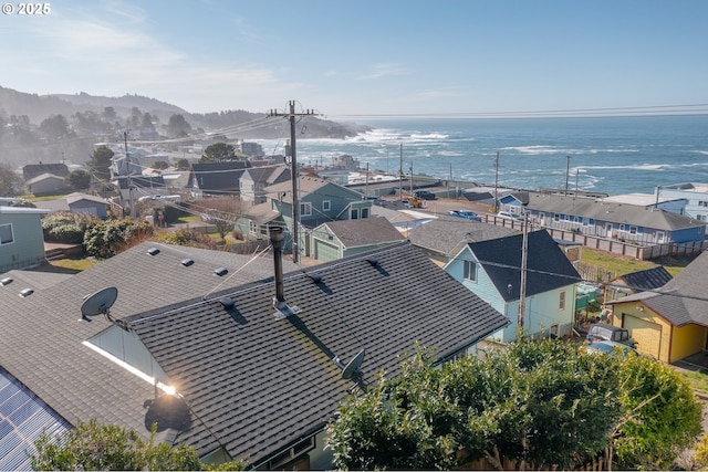 bird's eye view featuring a water view and a residential view