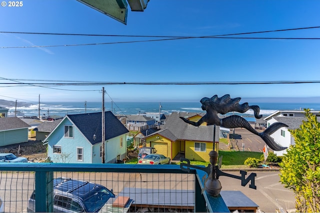 balcony featuring a residential view and a water view