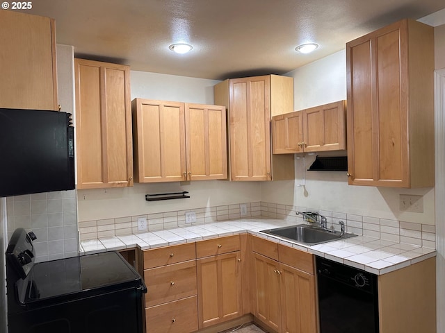 kitchen featuring sink, black appliances, and light brown cabinets