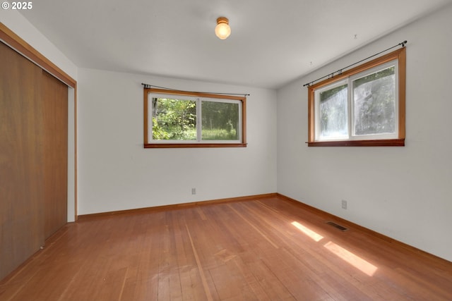 78650 Rat Creek Rd, Cottage Grove, OR 97424 - unfurnished bedroom with wood-type flooring, a closet, and baseboards