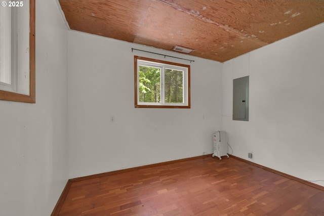 78650 Rat Creek Rd, Cottage Grove, OR 97424 - empty room featuring electric panel, radiator, wood finished floors, and baseboards