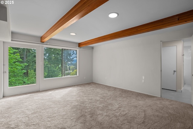 unfurnished room with carpet flooring, beam ceiling, and recessed lighting