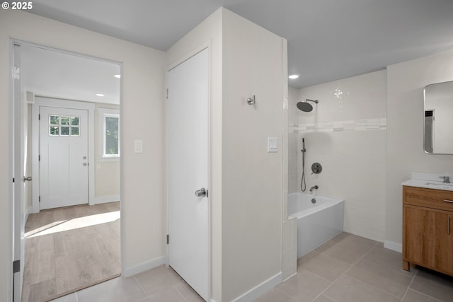 full bathroom with shower / tub combination, tile patterned floors, baseboards, vanity, and recessed lighting