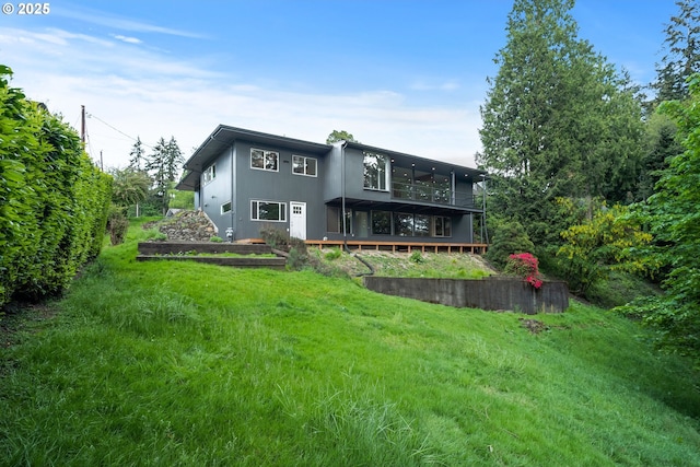 back of house with a deck