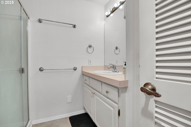 full bathroom featuring vanity, an enclosed shower, and tile patterned flooring