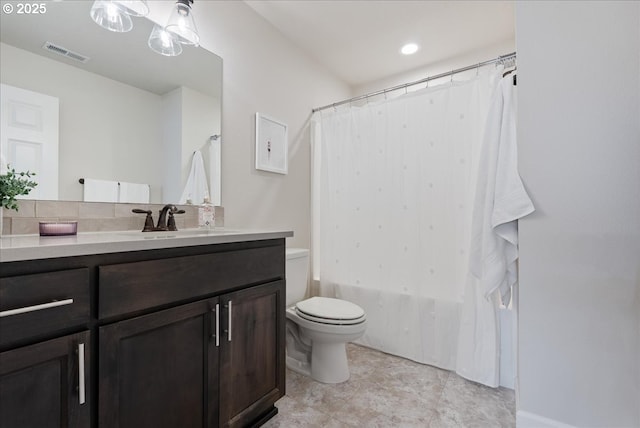 bathroom featuring visible vents, shower / bath combination with curtain, toilet, and vanity