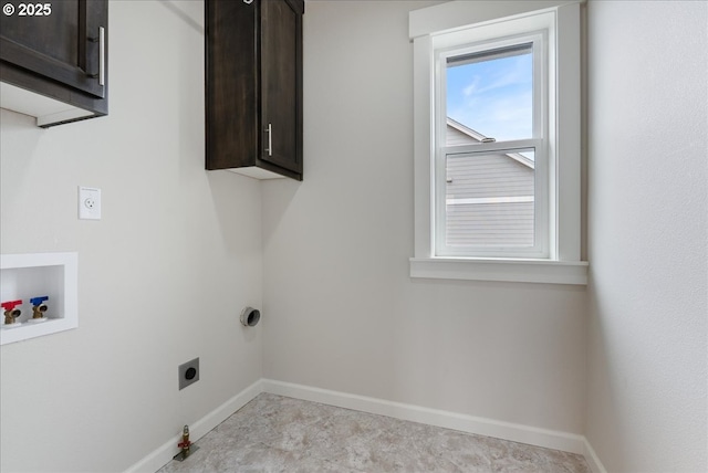 laundry area featuring electric dryer hookup, cabinet space, baseboards, gas dryer hookup, and hookup for a washing machine