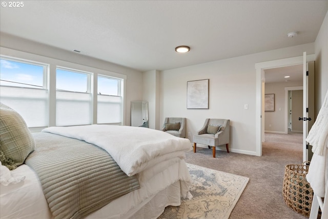 carpeted bedroom with baseboards