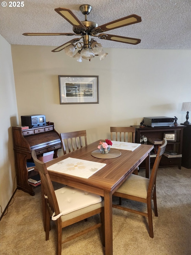 950 Evergreen Rd Unit 109, Woodburn, OR 97071 - dining area featuring light colored carpet, a ceiling fan, and a textured ceiling