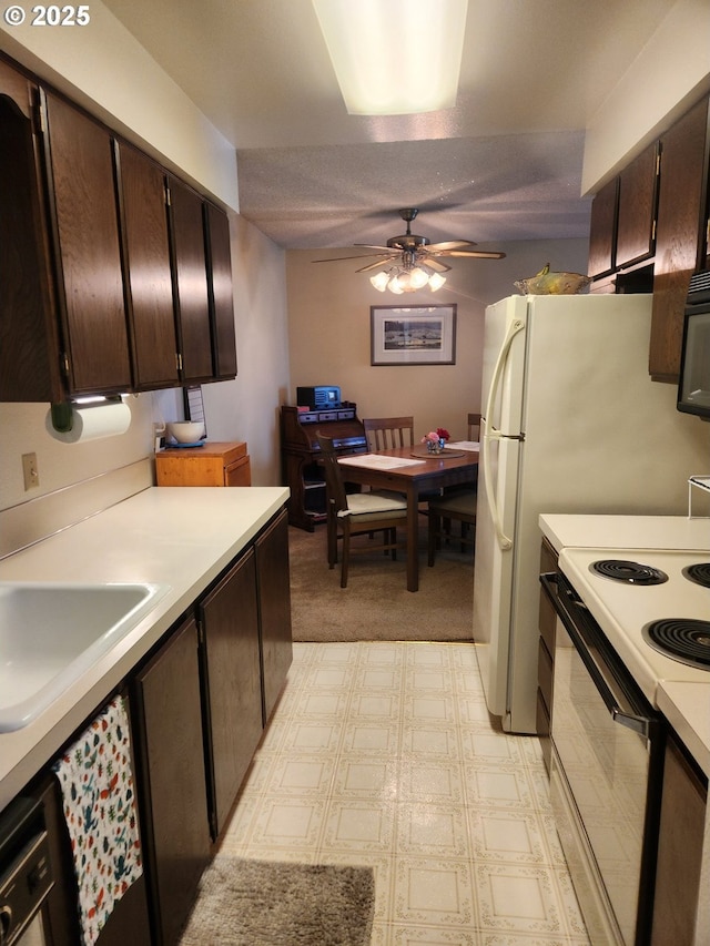 950 Evergreen Rd Unit 109, Woodburn, OR 97071 - kitchen with electric stove, light countertops, a ceiling fan, dark brown cabinets, and a sink