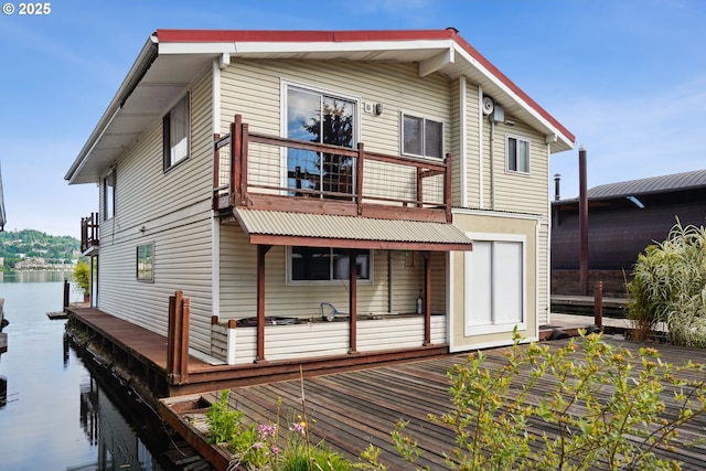 6901 SE Oaks Park Way Unit 1, Portland, OR 97202 - back of property featuring a balcony and a water view