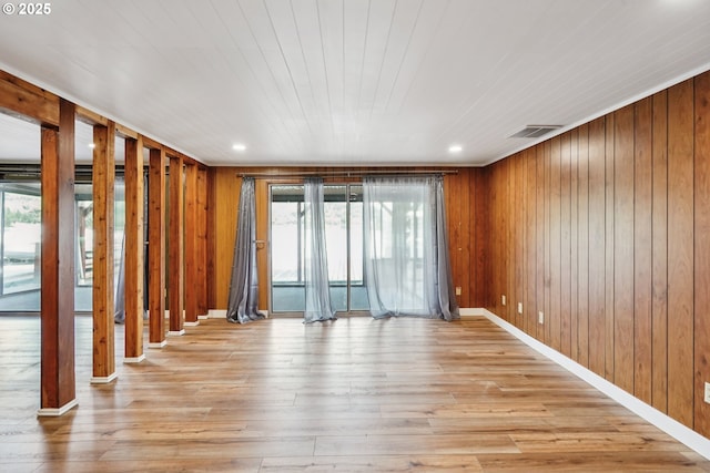 6901 SE Oaks Park Way Unit 1, Portland, OR 97202 - empty room with wood-type flooring, wood walls, and recessed lighting