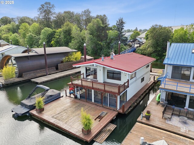 6901 SE Oaks Park Way Unit 1, Portland, OR 97202 - back of property with metal roof and a water view