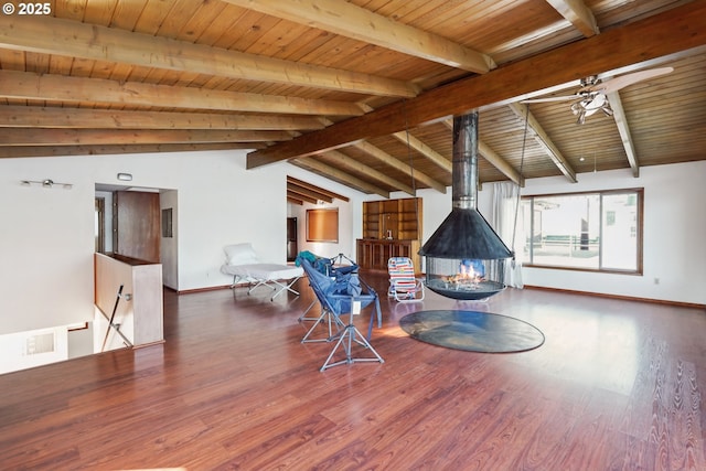 6901 SE Oaks Park Way Unit 1, Portland, OR 97202 - sitting room with wooden ceiling, wood finished floors, baseboards, ceiling fan, and a wood stove