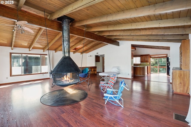 6901 SE Oaks Park Way Unit 1, Portland, OR 97202 - living area with a wood stove, wooden ceiling, wood finished floors, ceiling fan, and baseboards