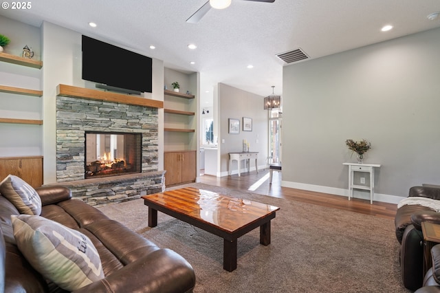 19428 NE 259th St, Battle Ground, WA 98604 - carpeted living area with built in features, ceiling fan, a fireplace, recessed lighting, and wood finished floors