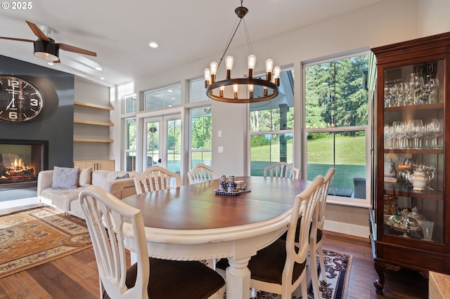 19428 NE 259th St, Battle Ground, WA 98604 - dining room featuring wood-type flooring, ceiling fan, a large fireplace, a chandelier, and recessed lighting
