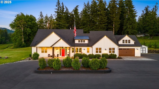 19428 NE 259th St, Battle Ground, WA 98604 - modern farmhouse style home featuring board and batten siding, driveway, an attached garage, and a front lawn