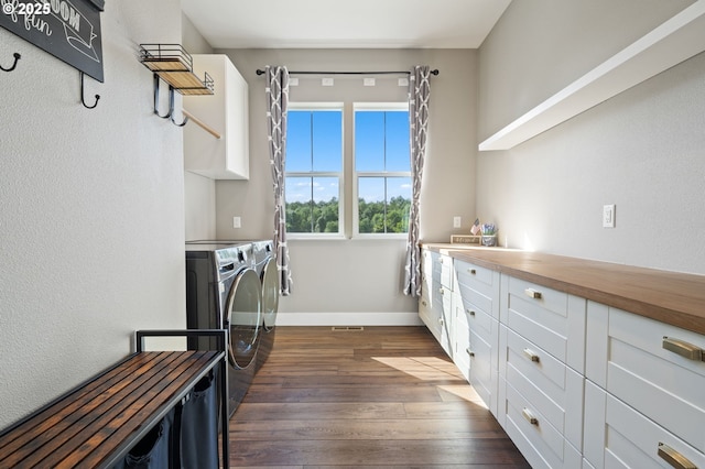 19428 NE 259th St, Battle Ground, WA 98604 - laundry room featuring washer and dryer, dark wood-style floors, baseboards, and cabinet space