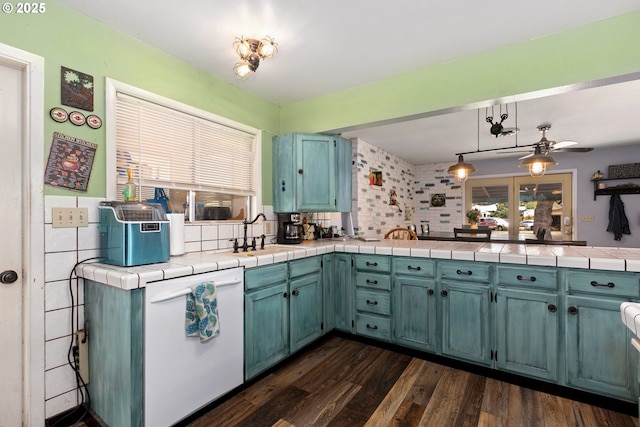2903 N Spruce St, La Grande, OR 97850 - kitchen featuring dishwasher, a sink, healthy amount of natural light, and dark wood finished floors