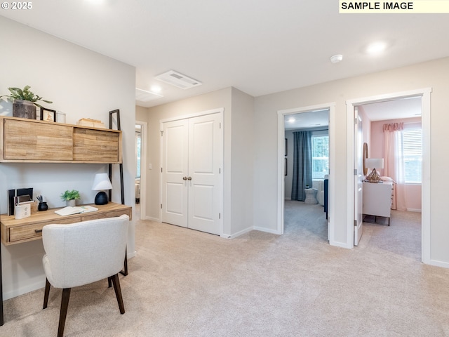 2109 NE 4th Ave, Battle Ground, WA 98604 - home office featuring light colored carpet, baseboards, and built in study area