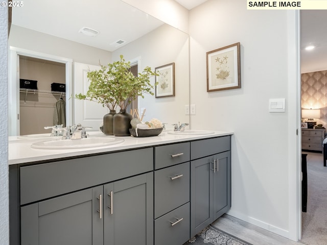 2109 NE 4th Ave, Battle Ground, WA 98604 - full bath with double vanity, baseboards, and a walk in closet