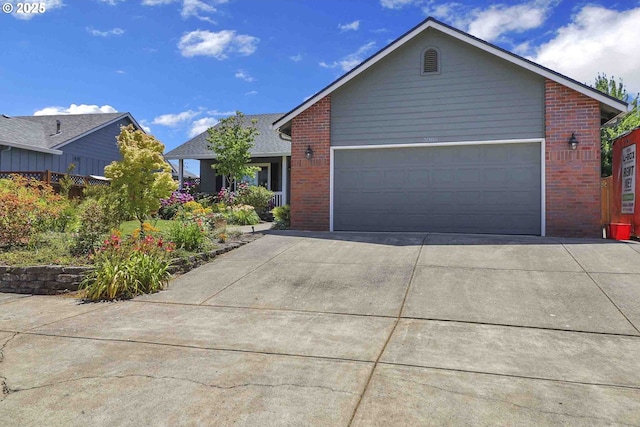 5986 Rombauer Rd, Eugene, OR 97402 - single story home featuring brick siding, driveway, and a garage