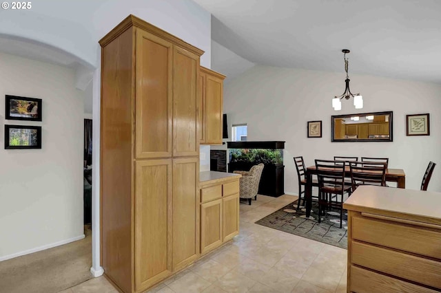 5986 Rombauer Rd, Eugene, OR 97402 - kitchen featuring vaulted ceiling, pendant lighting, and light countertops