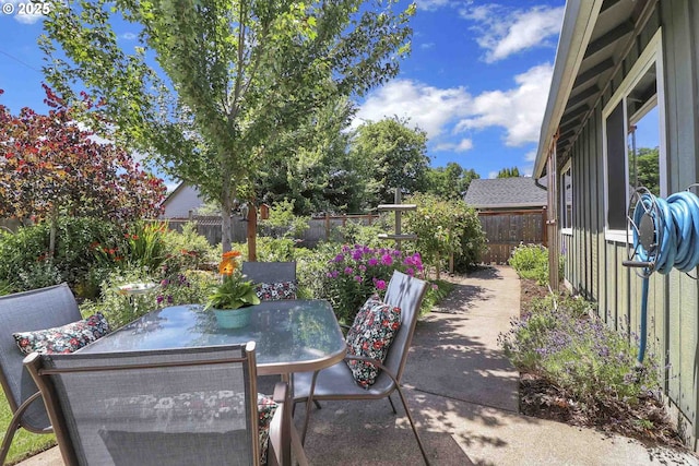5986 Rombauer Rd, Eugene, OR 97402 - fenced backyard featuring outdoor dining area and a patio area