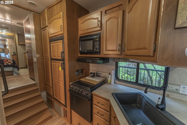 24706 NE Columbia Tie Rd Unit 41/21, Amboy, WA 98601 - kitchen with a sink, black microwave, stove, and light countertops